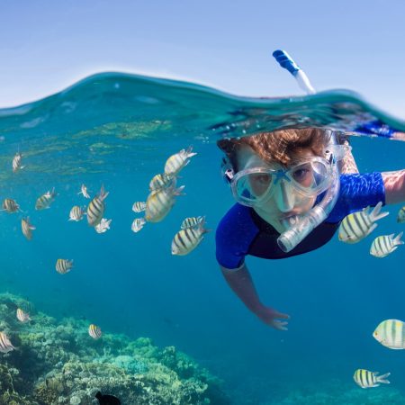 Mnemba-Child-snorkeling-reef-502642217-Website