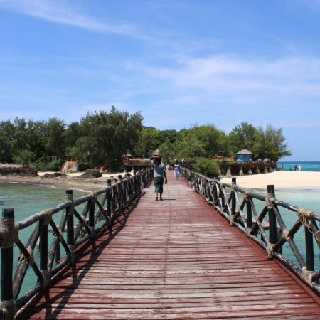Scenic wooden bridge leading to The Rock