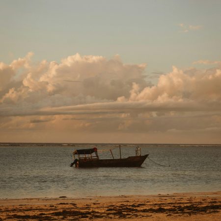 Traditional dhow boat at sunset in Zanzibar